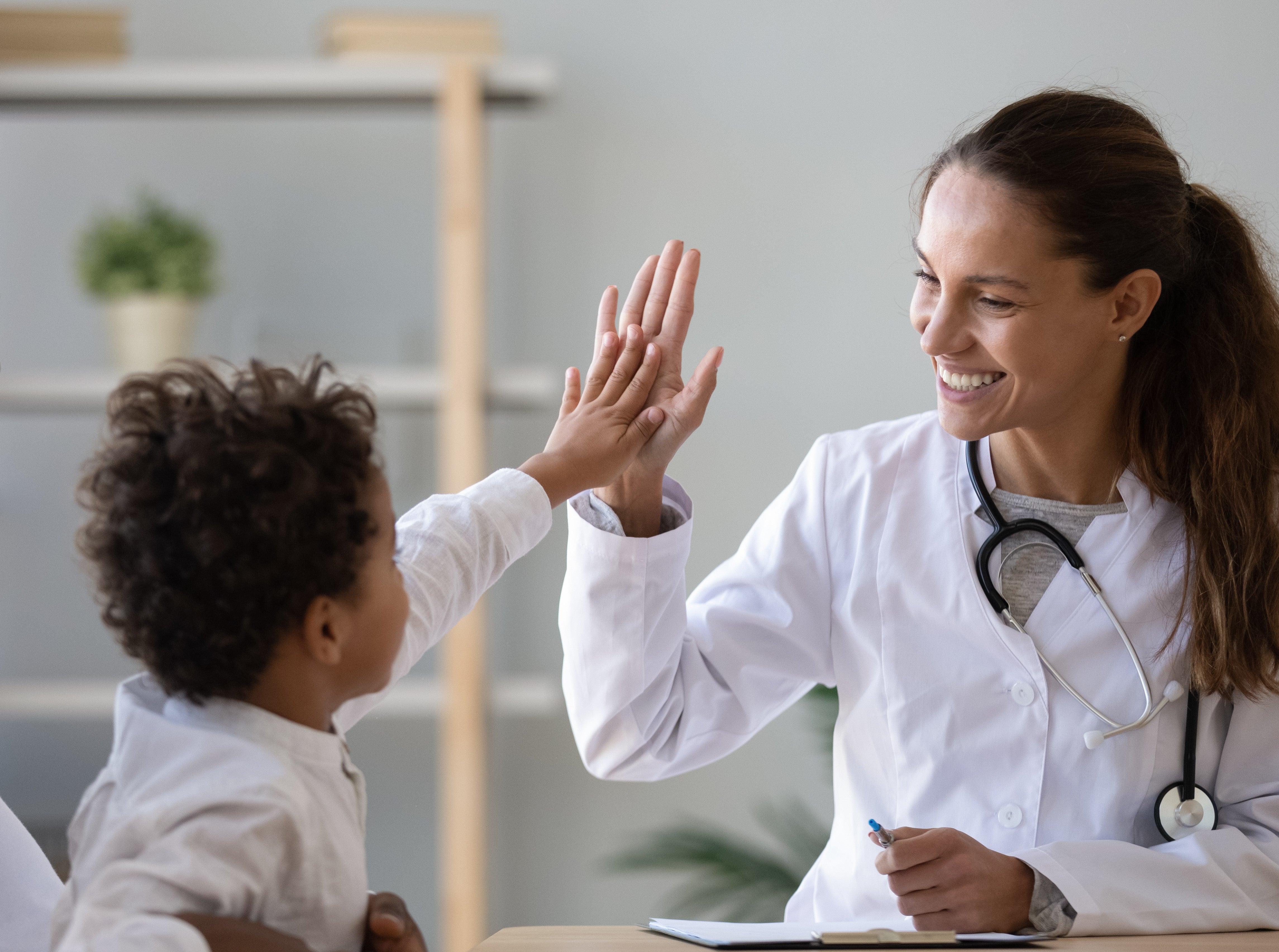 Pediatrician with patient